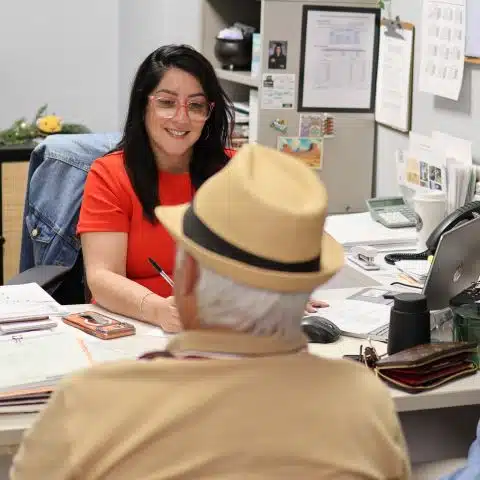 posso staff member helping client with personal matter